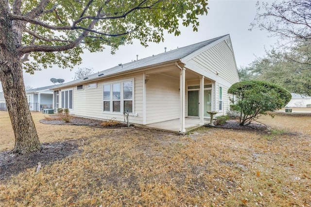 view of side of property featuring a patio