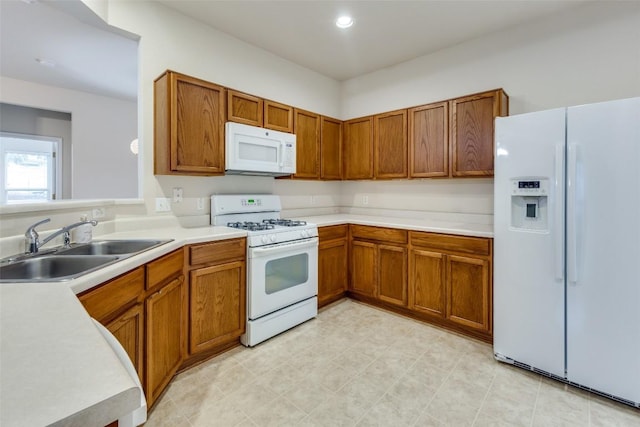 kitchen with sink and white appliances