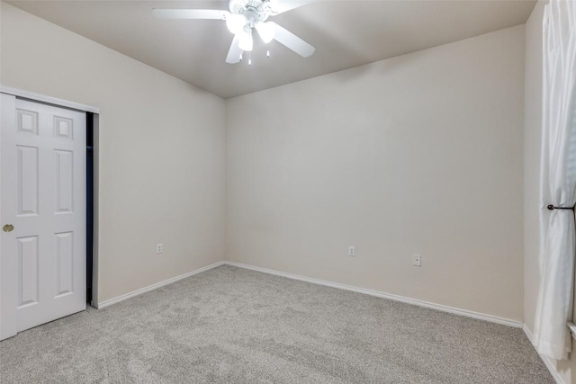 unfurnished bedroom featuring ceiling fan, a closet, and light carpet