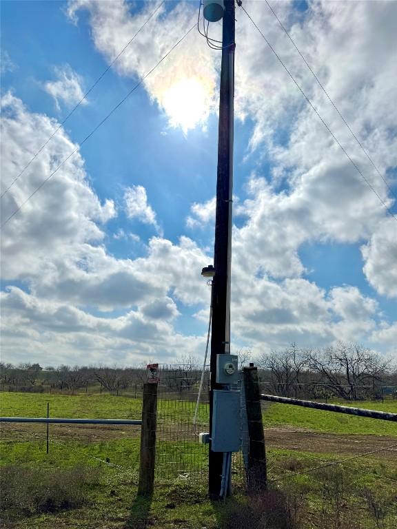 exterior details with electric meter and fence