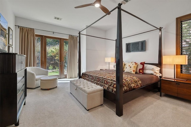 carpeted bedroom featuring french doors and ceiling fan