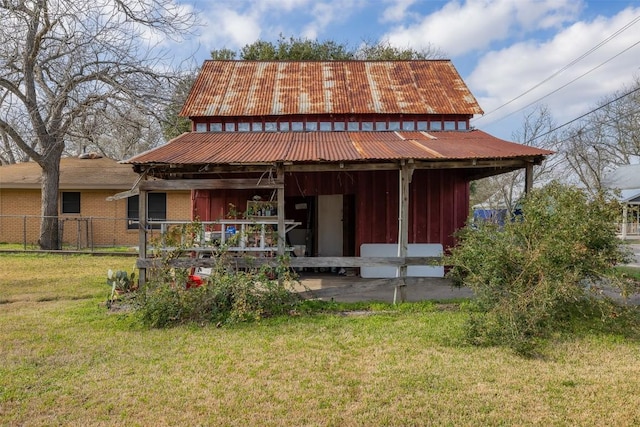 back of property with a lawn