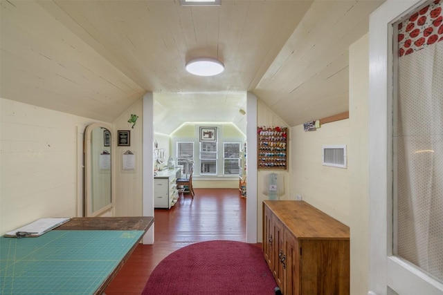 hallway featuring vaulted ceiling, wood ceiling, and dark hardwood / wood-style flooring