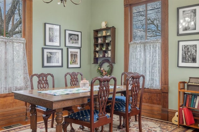 dining space featuring wood-type flooring