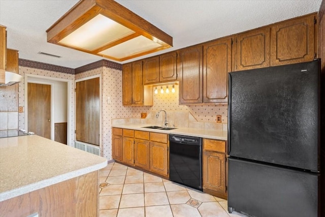 kitchen with sink, black appliances, and light tile patterned flooring