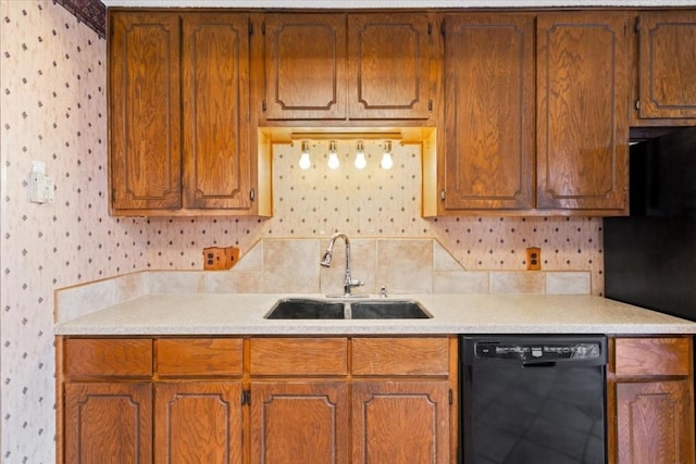 kitchen with sink, backsplash, and black appliances