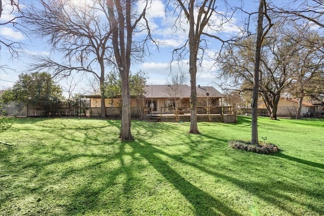 view of yard featuring a wooden deck