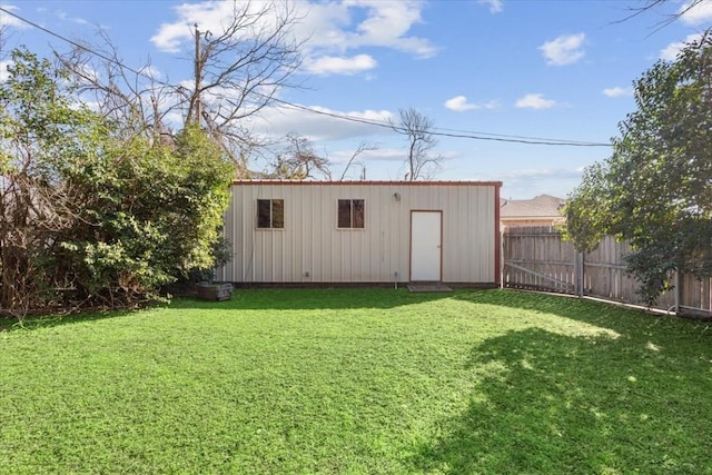 view of outdoor structure featuring a lawn