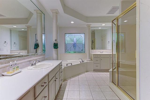 bathroom featuring ornate columns, plus walk in shower, vanity, and tile patterned floors