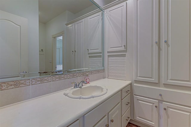 bathroom with vanity and backsplash