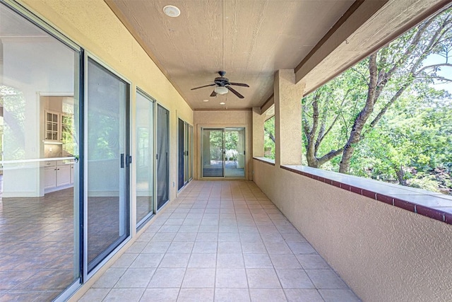 exterior space featuring ceiling fan