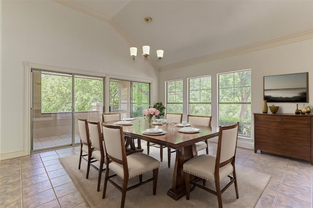 tiled dining room with ornamental molding and a healthy amount of sunlight