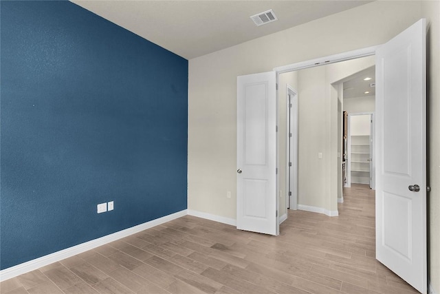 spare room with light wood-type flooring