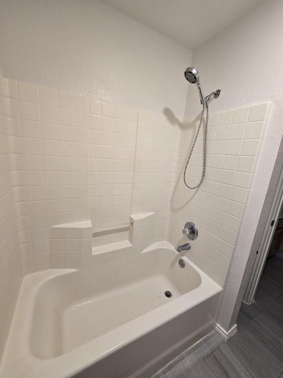 211 Valley Run Trl, Elgin, TX 78621 - full bath featuring bathing tub / shower combination and a textured wall