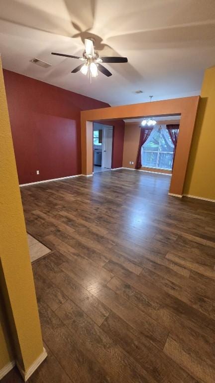 211 Valley Run Trl, Elgin, TX 78621 - spare room featuring visible vents, a ceiling fan, dark wood finished floors, and baseboards