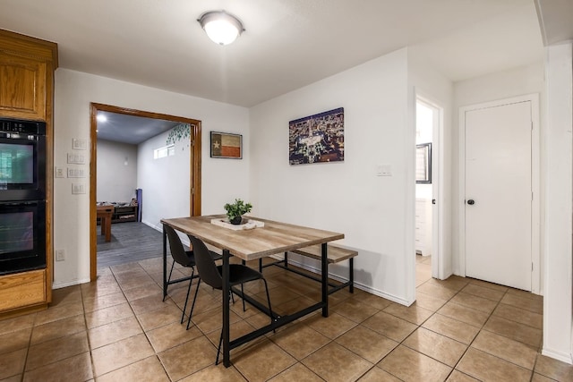 1000 Ledbetter St, Round Rock, TX 78681 - dining space with light tile patterned floors