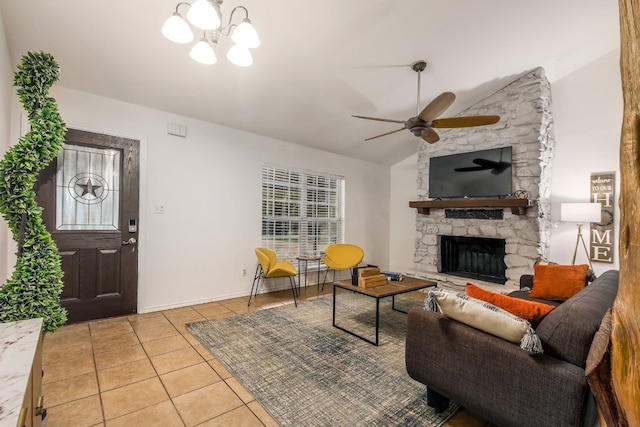 1000 Ledbetter St, Round Rock, TX 78681 - living room with tile patterned floors, a ceiling fan, a chandelier, lofted ceiling, and a fireplace