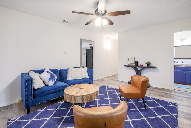1000 Ledbetter St, Round Rock, TX 78681 - living area featuring wood finished floors and ceiling fan