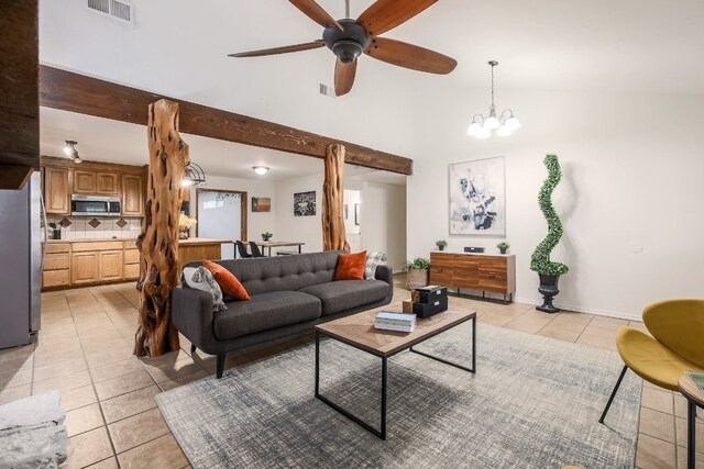 1000 Ledbetter St, Round Rock, TX 78681 - living room with light tile patterned flooring, ceiling fan, and high vaulted ceiling