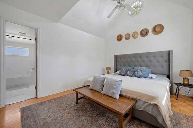 bedroom featuring lofted ceiling, parquet floors, connected bathroom, and ceiling fan