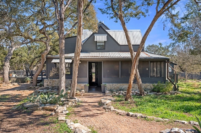 view of front of house featuring a sunroom