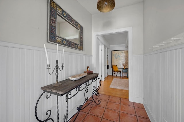 hallway with tile patterned floors