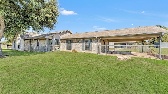 1252 County Road 106, Paige, TX 78659 - rear view of house featuring a lawn, a gate, fence, and an attached carport