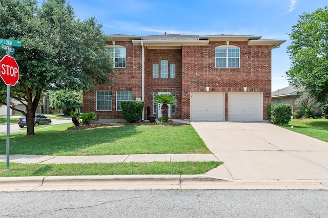 view of front of home featuring a garage and a front yard