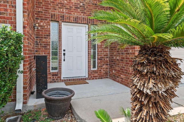 property entrance featuring a patio area