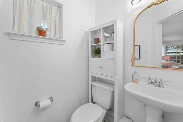 bathroom featuring sink and toilet