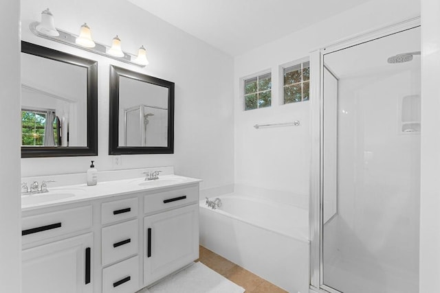 bathroom with independent shower and bath and vanity