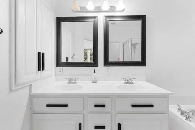 bathroom with vanity and an enclosed shower