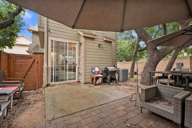 view of patio / terrace with central AC and grilling area