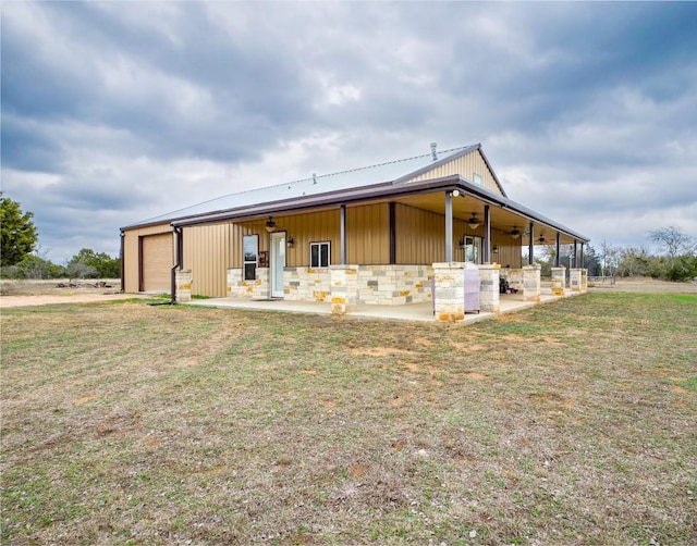 view of front of home with a garage and a front yard