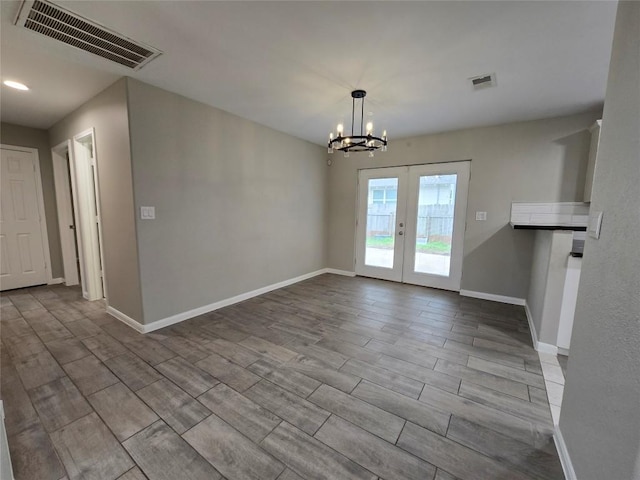 177 E Davilla St, Bartlett, TX 76511 - unfurnished dining area featuring baseboards, a notable chandelier, french doors, and visible vents