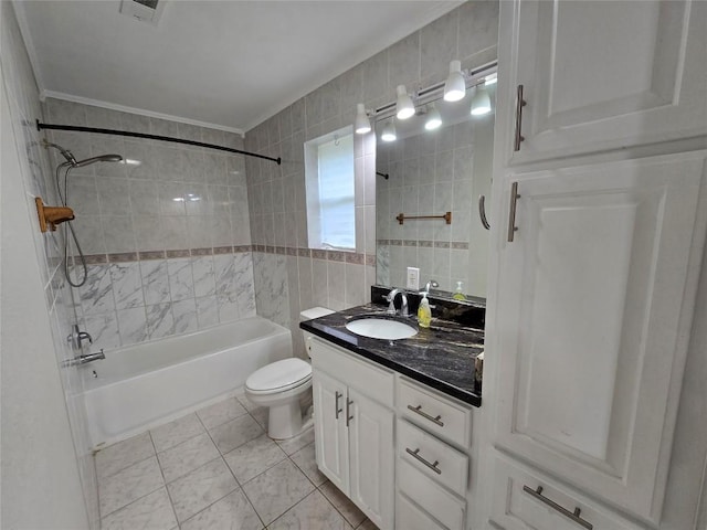 177 E Davilla St, Bartlett, TX 76511 - bathroom featuring toilet, tile walls, visible vents, vanity, and shower / tub combination