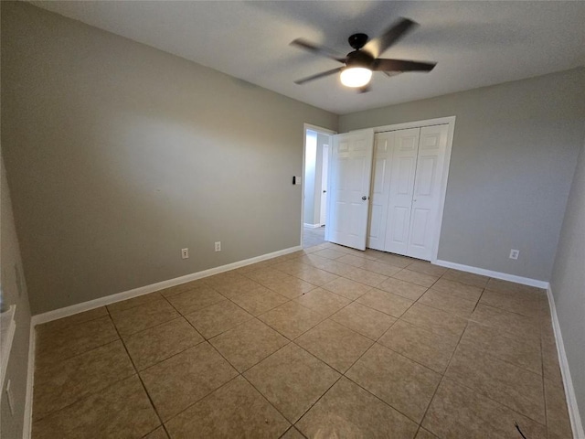 177 E Davilla St, Bartlett, TX 76511 - unfurnished bedroom with a closet, tile patterned floors, baseboards, and a ceiling fan