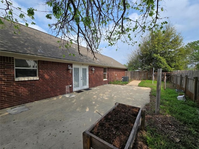 177 E Davilla St, Bartlett, TX 76511 - view of patio featuring a fenced backyard and french doors