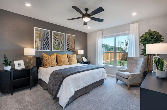 carpeted bedroom with ceiling fan