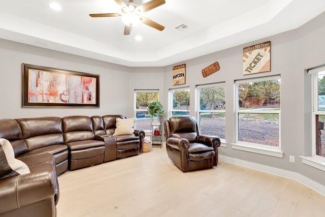 197 Bristlecone Dr, Driftwood, TX 78619 - living area featuring a tray ceiling, recessed lighting, a ceiling fan, baseboards, and wood finished floors