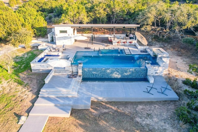 view of swimming pool featuring a patio area