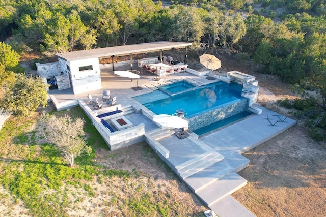 view of swimming pool featuring a patio area