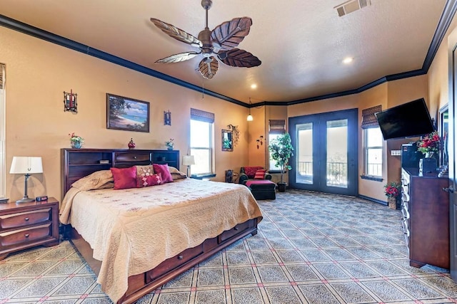 carpeted bedroom featuring ornamental molding, a textured ceiling, access to exterior, and ceiling fan