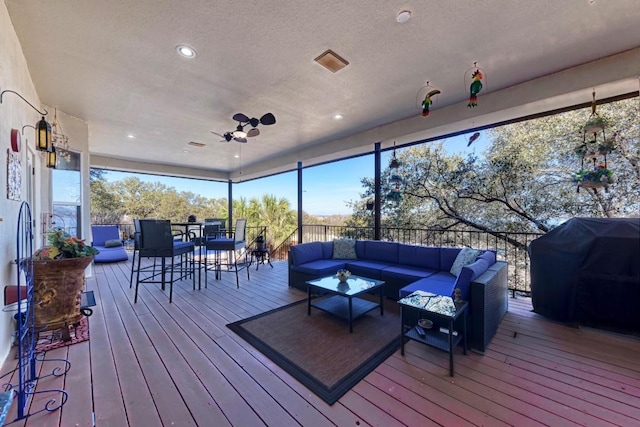 deck with grilling area and an outdoor hangout area