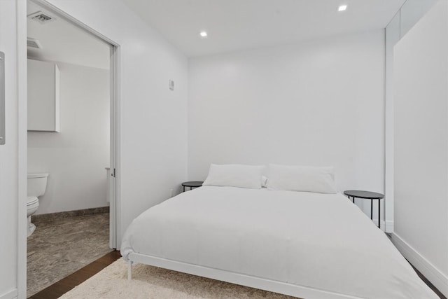 bedroom featuring dark hardwood / wood-style flooring