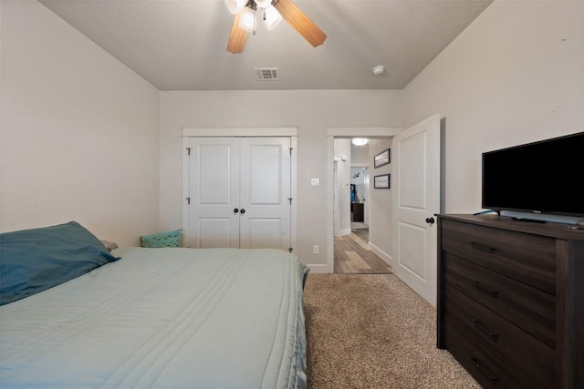 bedroom with carpet flooring, ceiling fan, and a closet