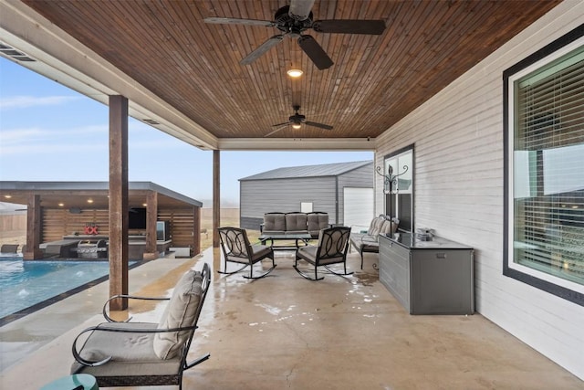 view of patio / terrace with a fenced in pool, an outdoor hangout area, and ceiling fan