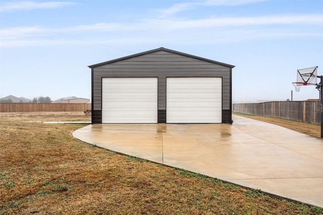 garage featuring a lawn