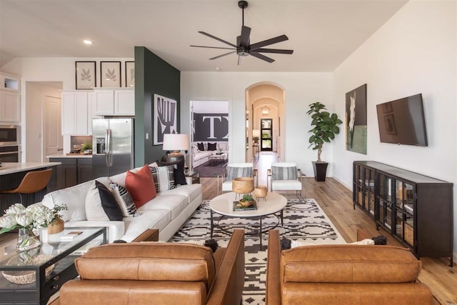 2516 Carretera Dr, Leander, TX 78641 - living area featuring arched walkways, a ceiling fan, light wood-type flooring, and recessed lighting