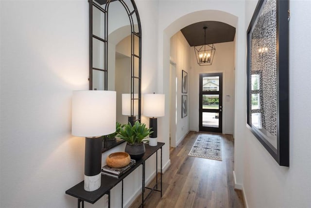 2516 Carretera Dr, Leander, TX 78641 - entryway featuring arched walkways, wood finished floors, and a chandelier